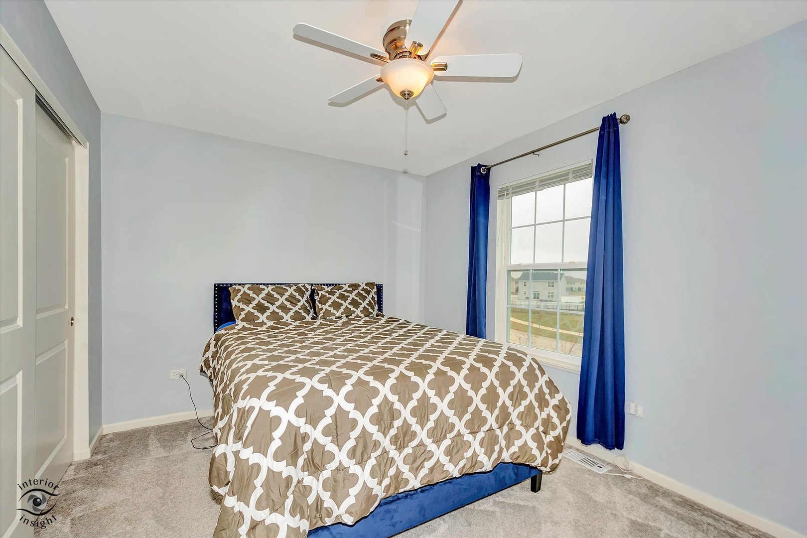 15101 Quincy Way Manhattan, IL 60442 - Photo 25 of 28 a bedroom with a bed and a chandelier