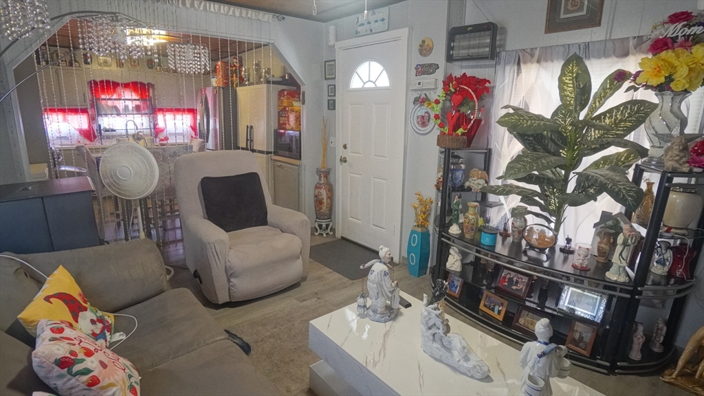93 Grochmal Avenue, Unit 126 Springfield, MA 01151 - Photo 19 of 35 a living room with furniture and a potted plant