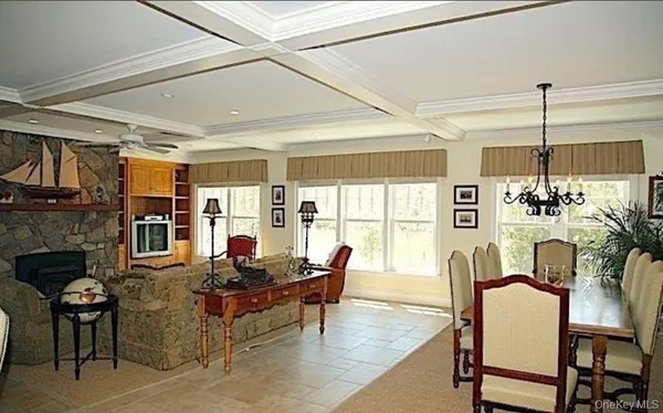 a living room with furniture fireplace and flat screen tv