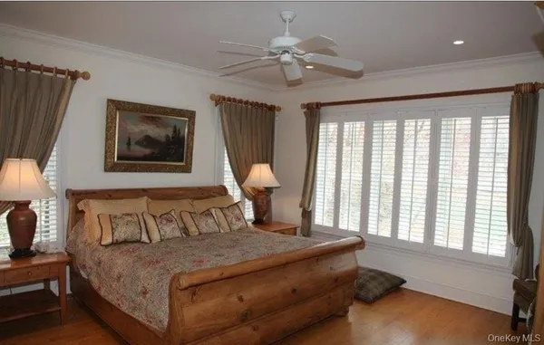a bedroom with a large bed and a window
