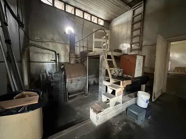 a kitchen with a refrigerator and a stove