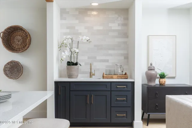 a kitchen with a table and chairs in it