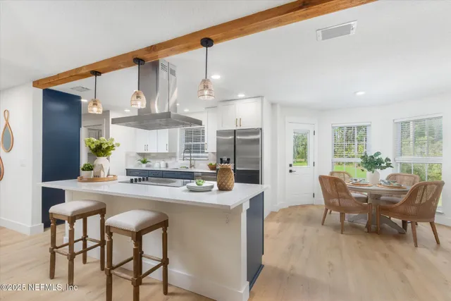 a kitchen with a sink cabinets and window