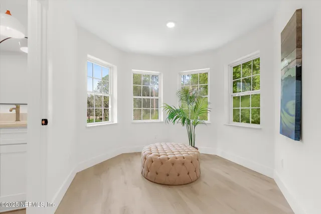 a bathroom with a granite countertop sink a toilet and a mirror