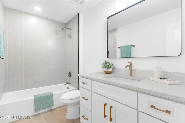 a view of a chair and table in backyard of the house