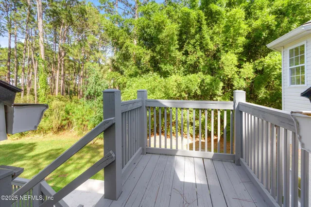a view of a lake with beach and outdoor space