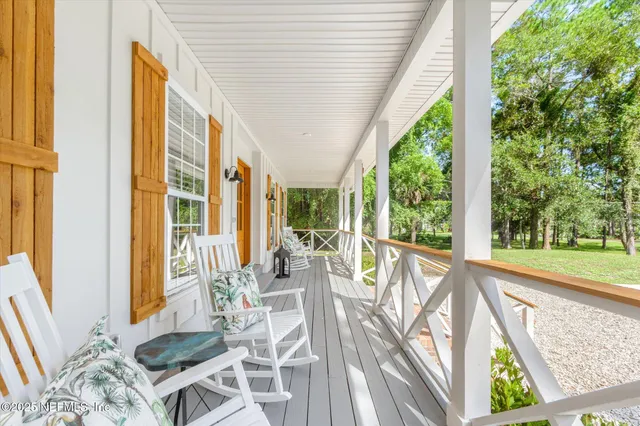 a front view of a house with garden and patio
