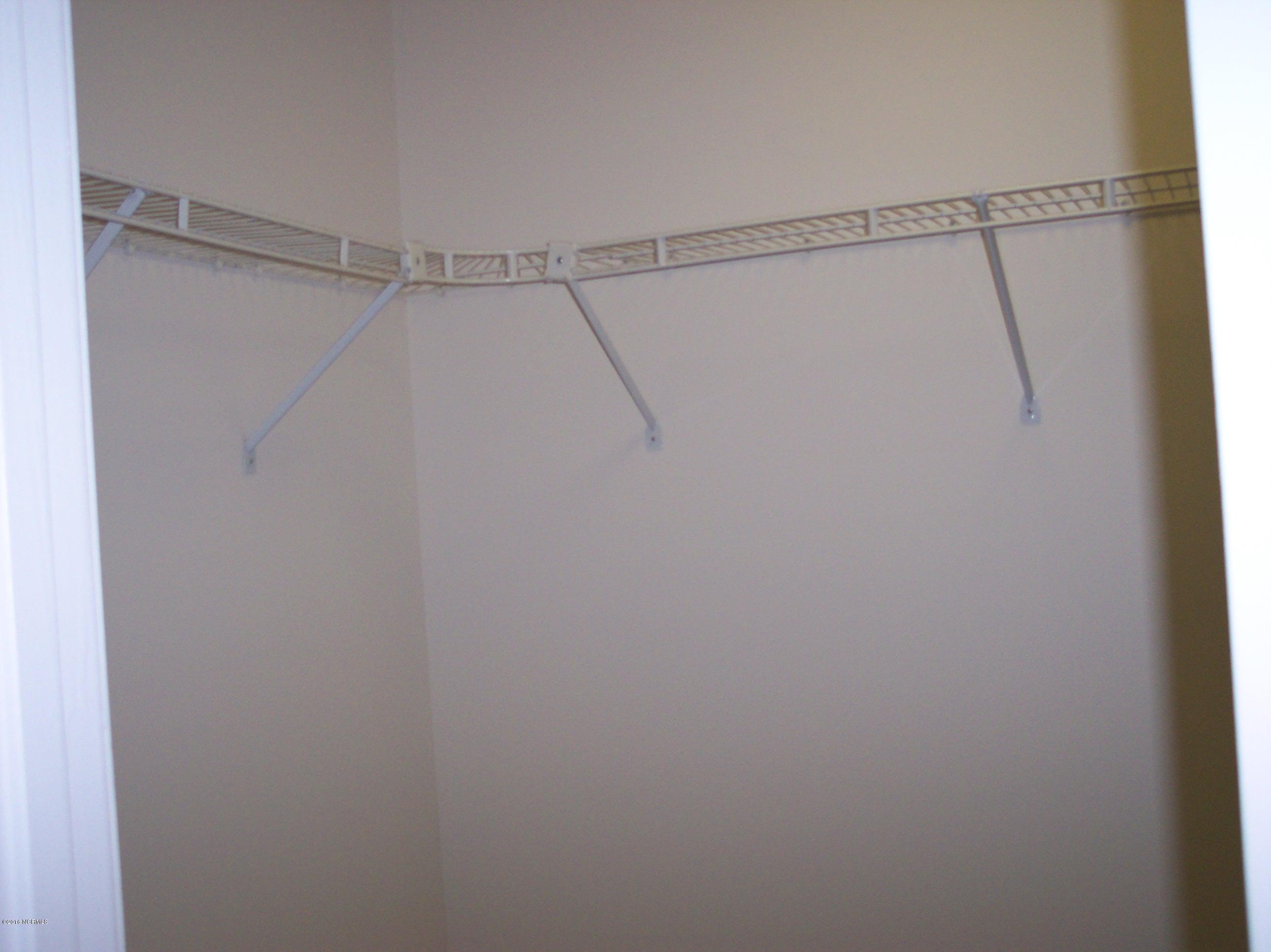 695 Pepperhill Road, Unit BSL Southport, NC 28461 - Photo 12 of 33 Master bedroom walk-in closet