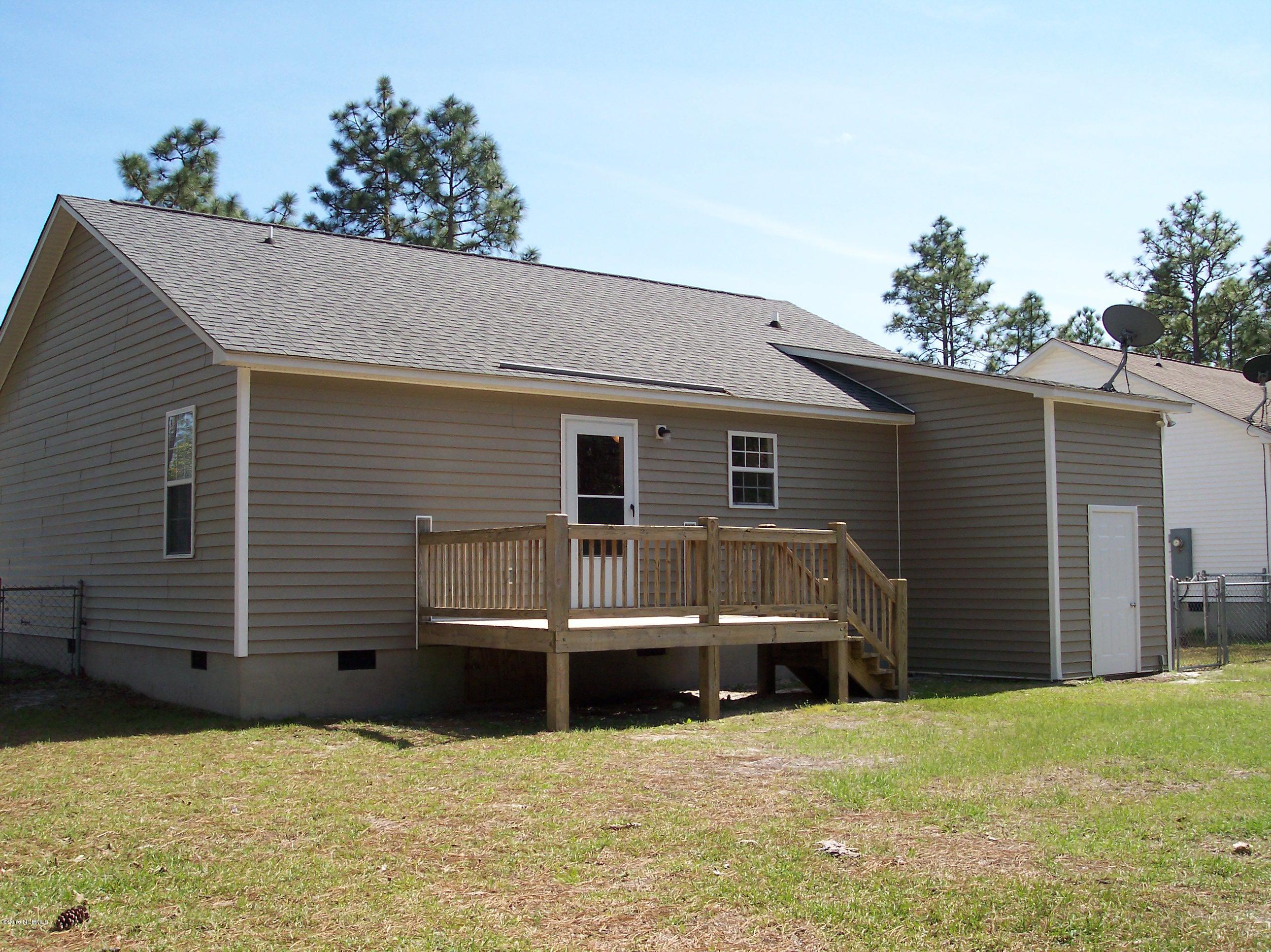 695 Pepperhill Road, Unit BSL Southport, NC 28461 - Photo 21 of 33 Back deck and storage