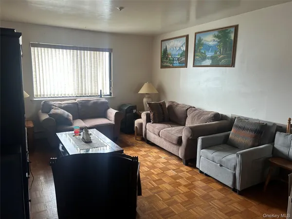 a living room with furniture and window