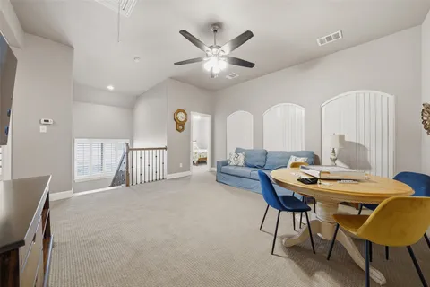a workspace with furniture and a chandelier