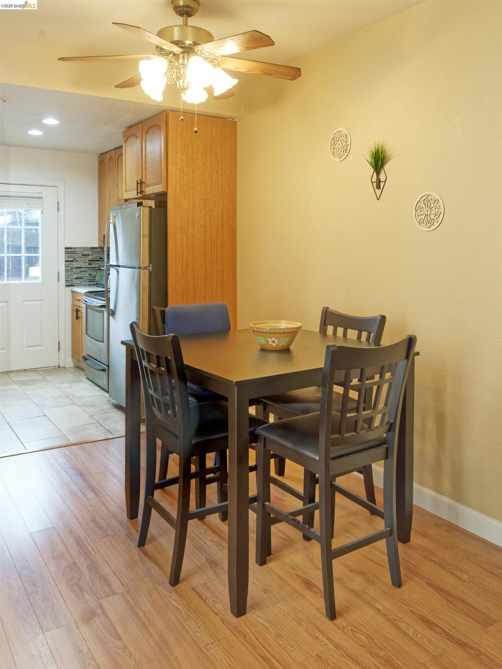 10 Leighty Court, Unit 5 Hayward, CA 94541 - Photo 11 of 22 Dining area featuring ceiling fan, light wood-style floors, and recessed lighting