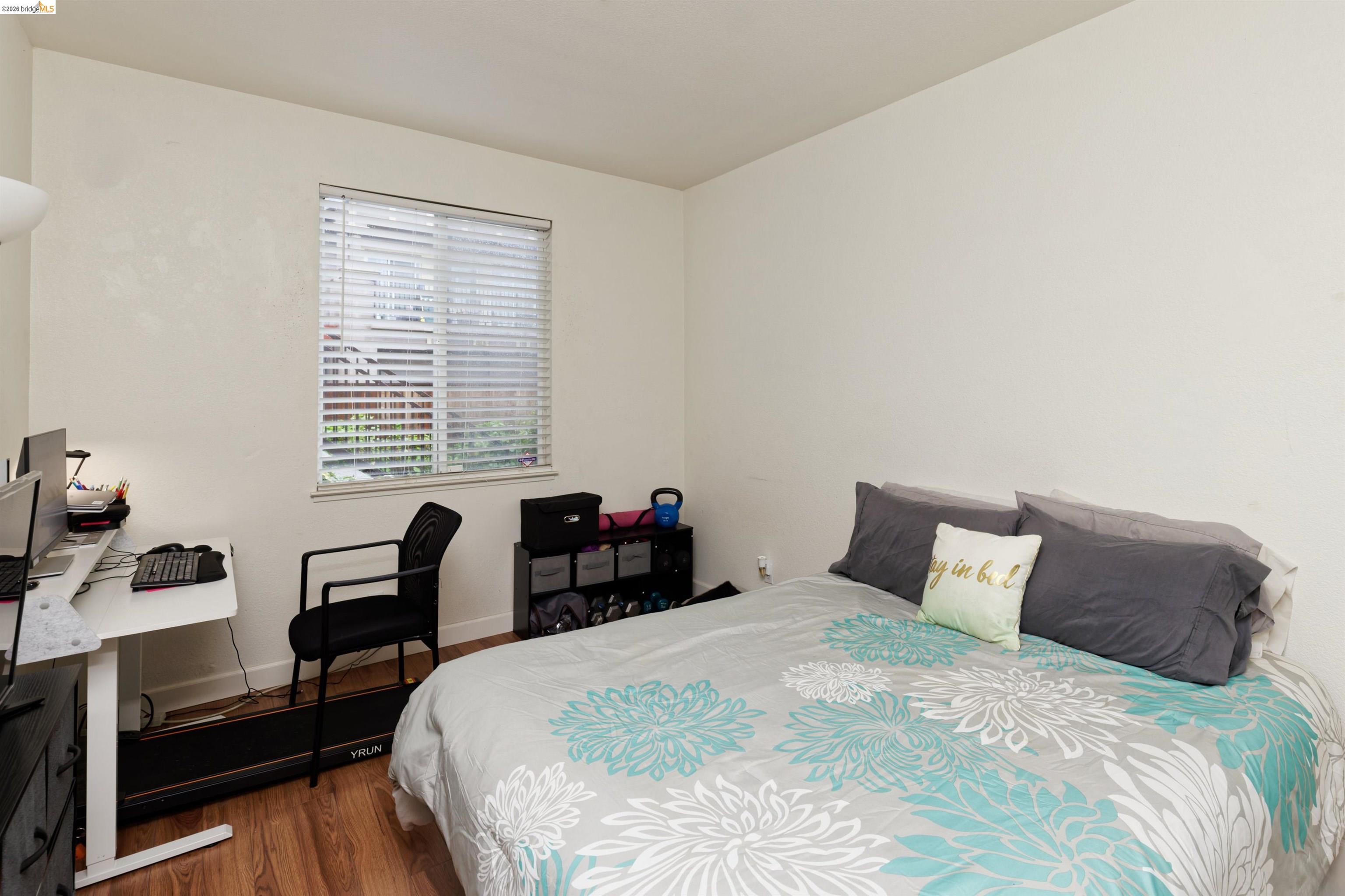 10 Leighty Court, Unit 5 Hayward, CA 94541 - Photo 17 of 22 Bedroom featuring dark wood-style flooring and baseboards