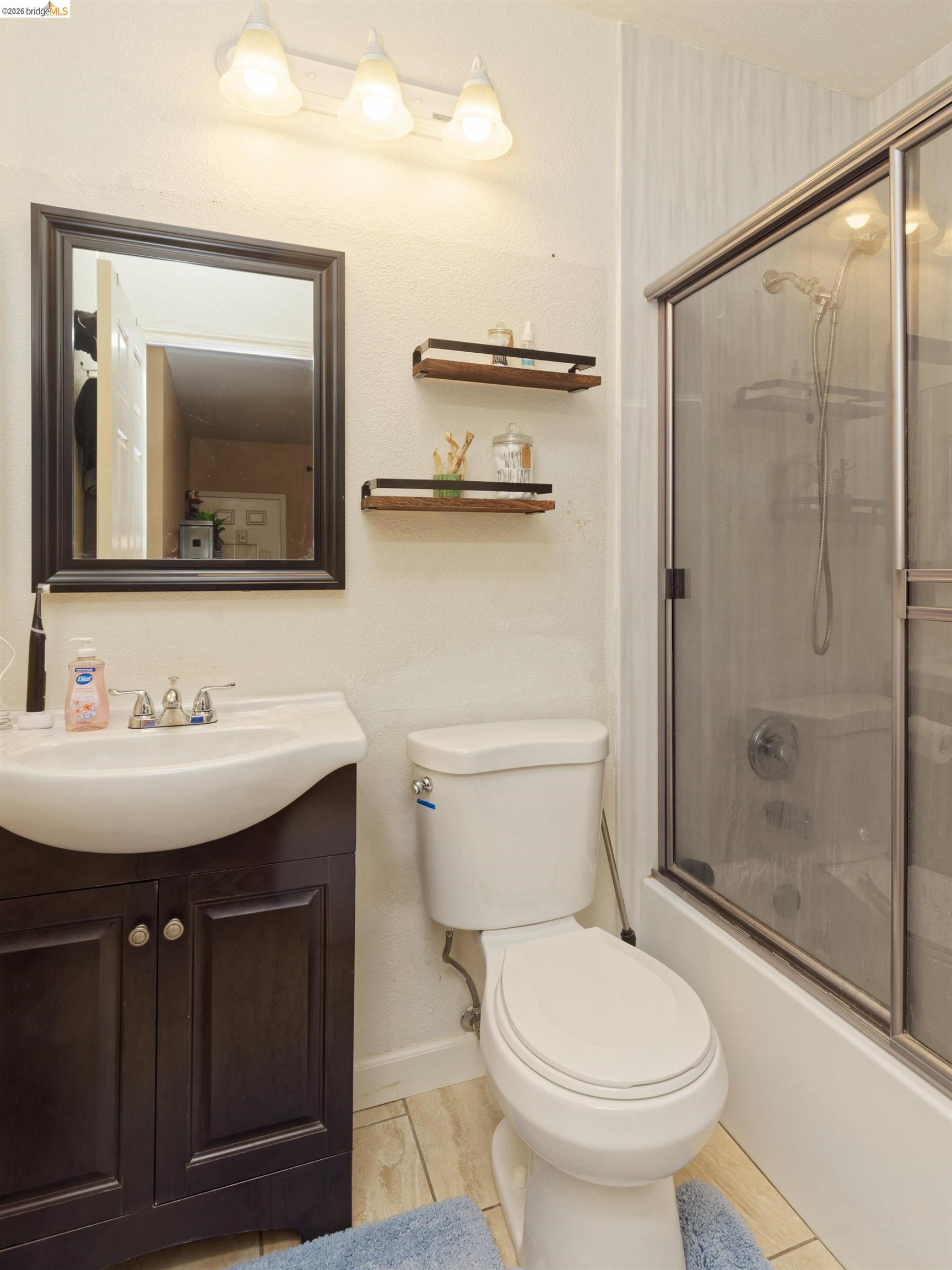 10 Leighty Court, Unit 5 Hayward, CA 94541 - Photo 19 of 22 Bathroom featuring vanity and shower / bath combination with glass door