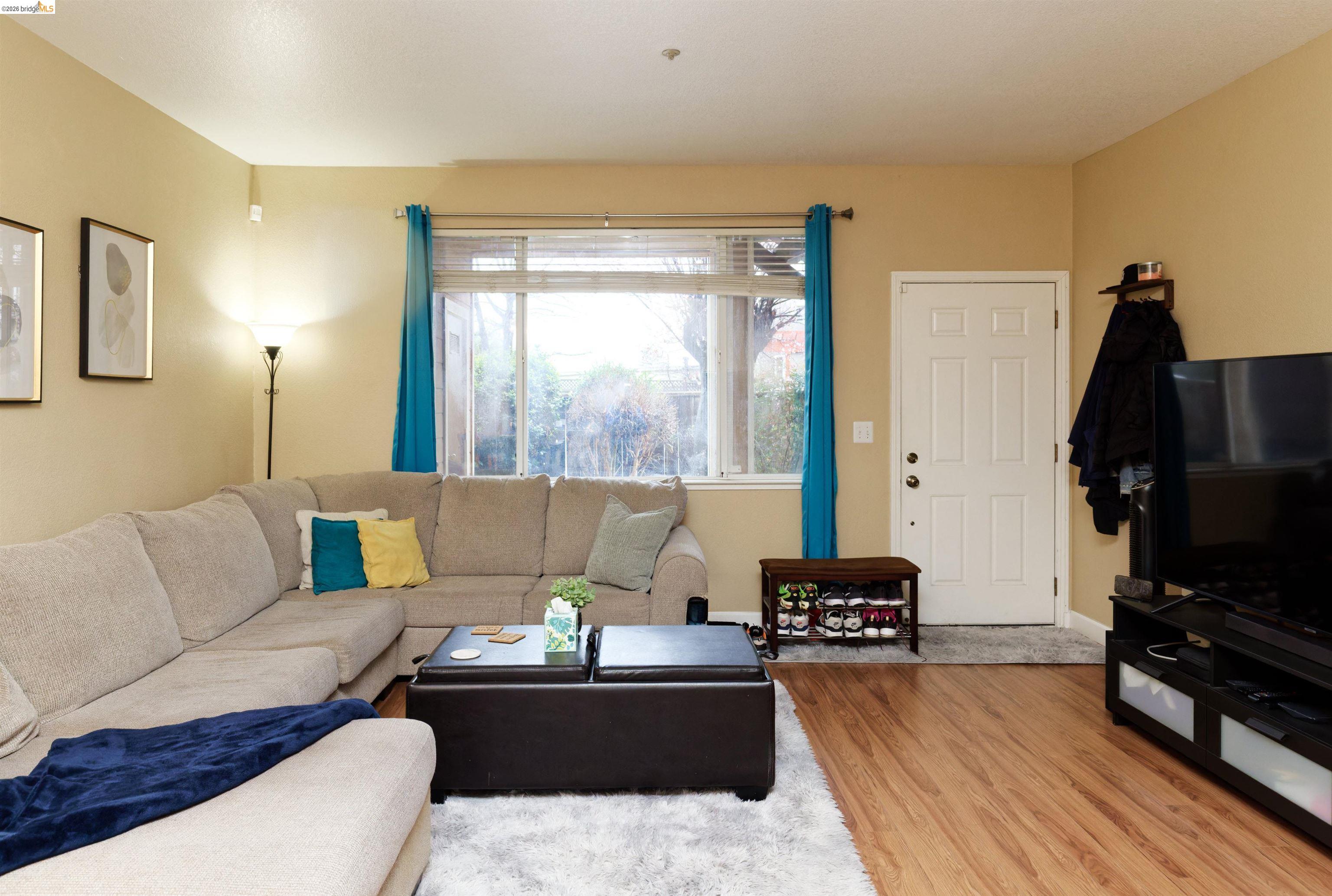 10 Leighty Court, Unit 5 Hayward, CA 94541 - Photo 6 of 22 Living area featuring light wood finished floors and baseboards