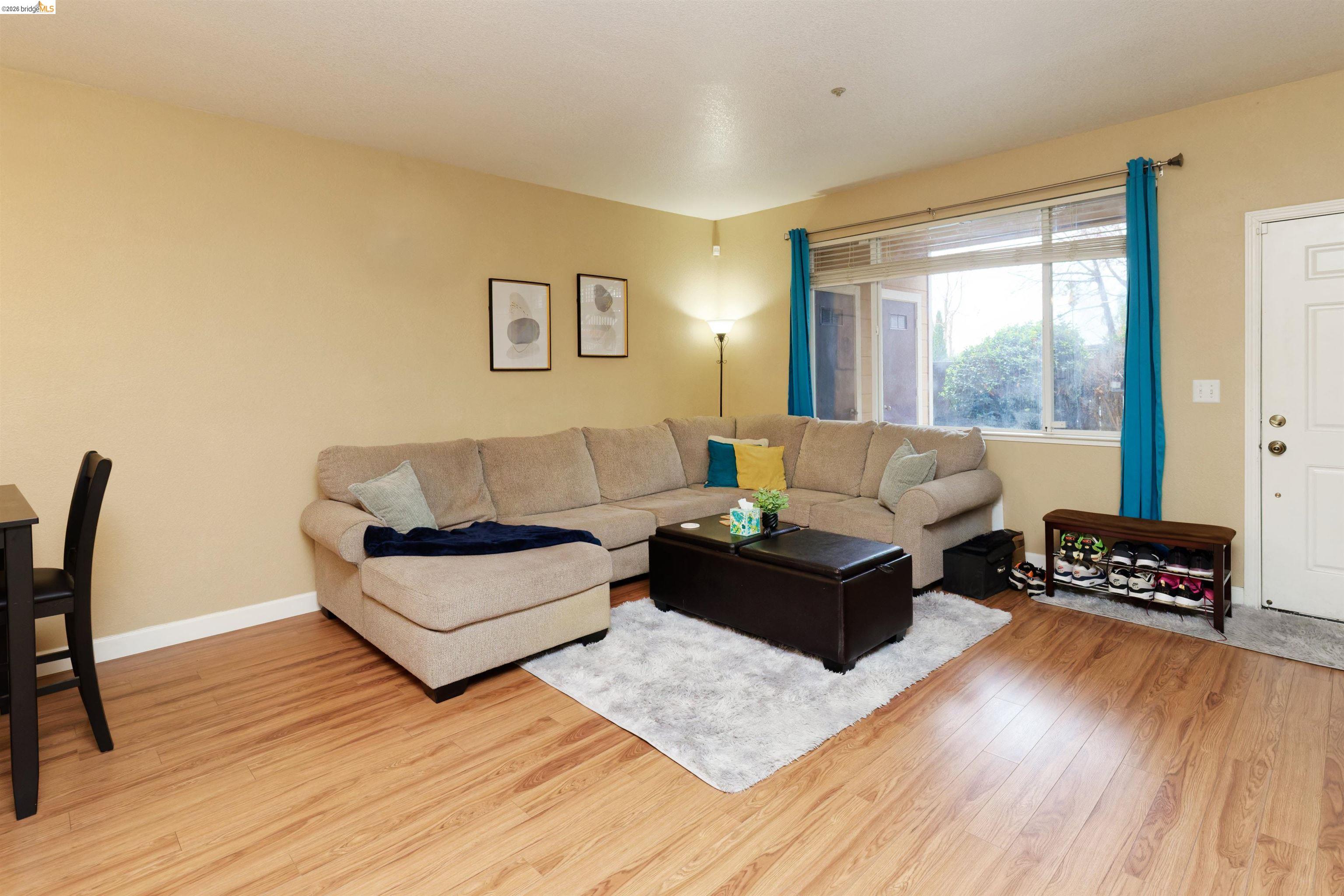 10 Leighty Court, Unit 5 Hayward, CA 94541 - Photo 8 of 22 Living room with light wood-style floors and baseboards
