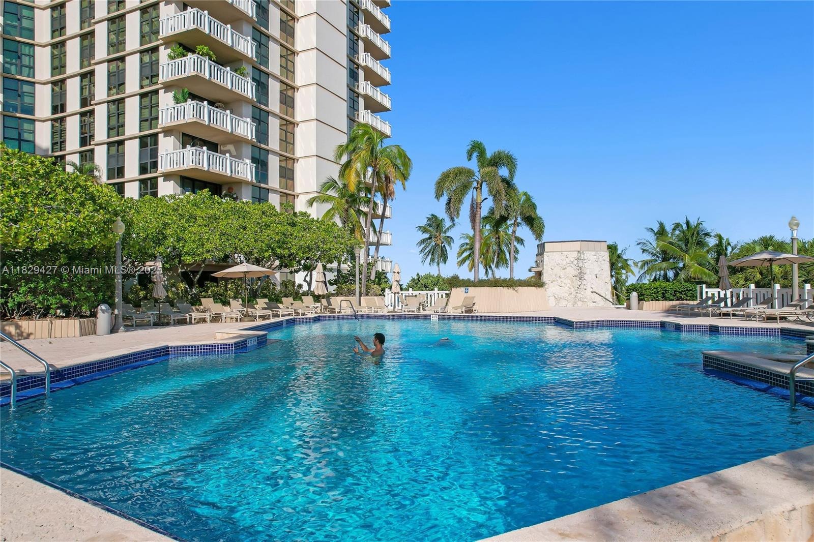 1121 Crandon Boulevard, Unit F201 Key Biscayne, FL 33149 - Photo 12 of 56 a view of a lake with a building in the background