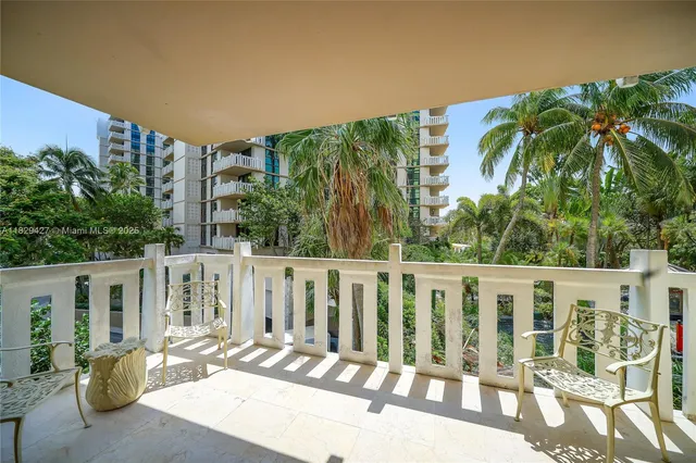 a view of a balcony with chairs