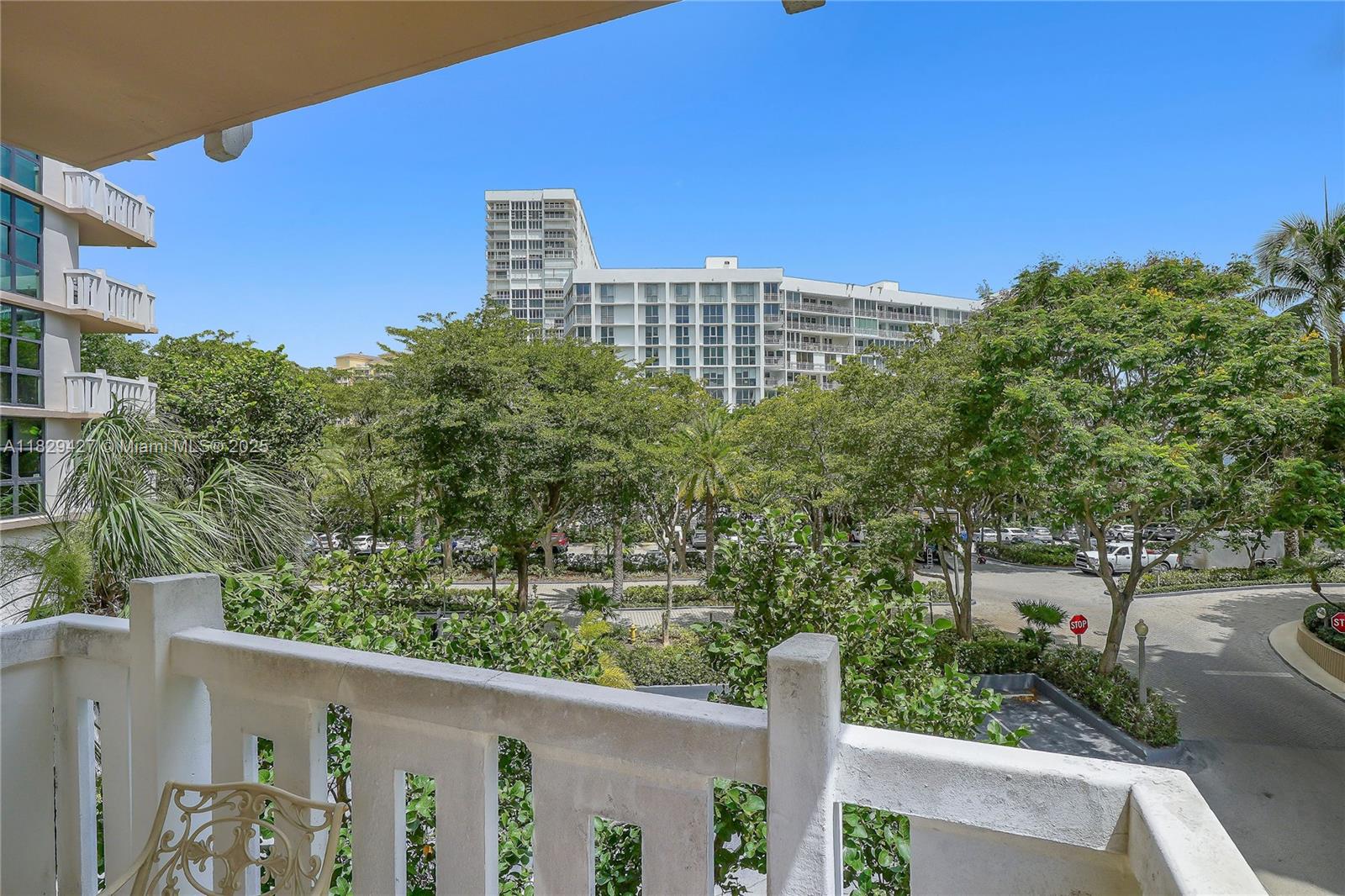 1121 Crandon Boulevard, Unit F201 Key Biscayne, FL 33149 - Photo 17 of 56 a view of a building from a balcony