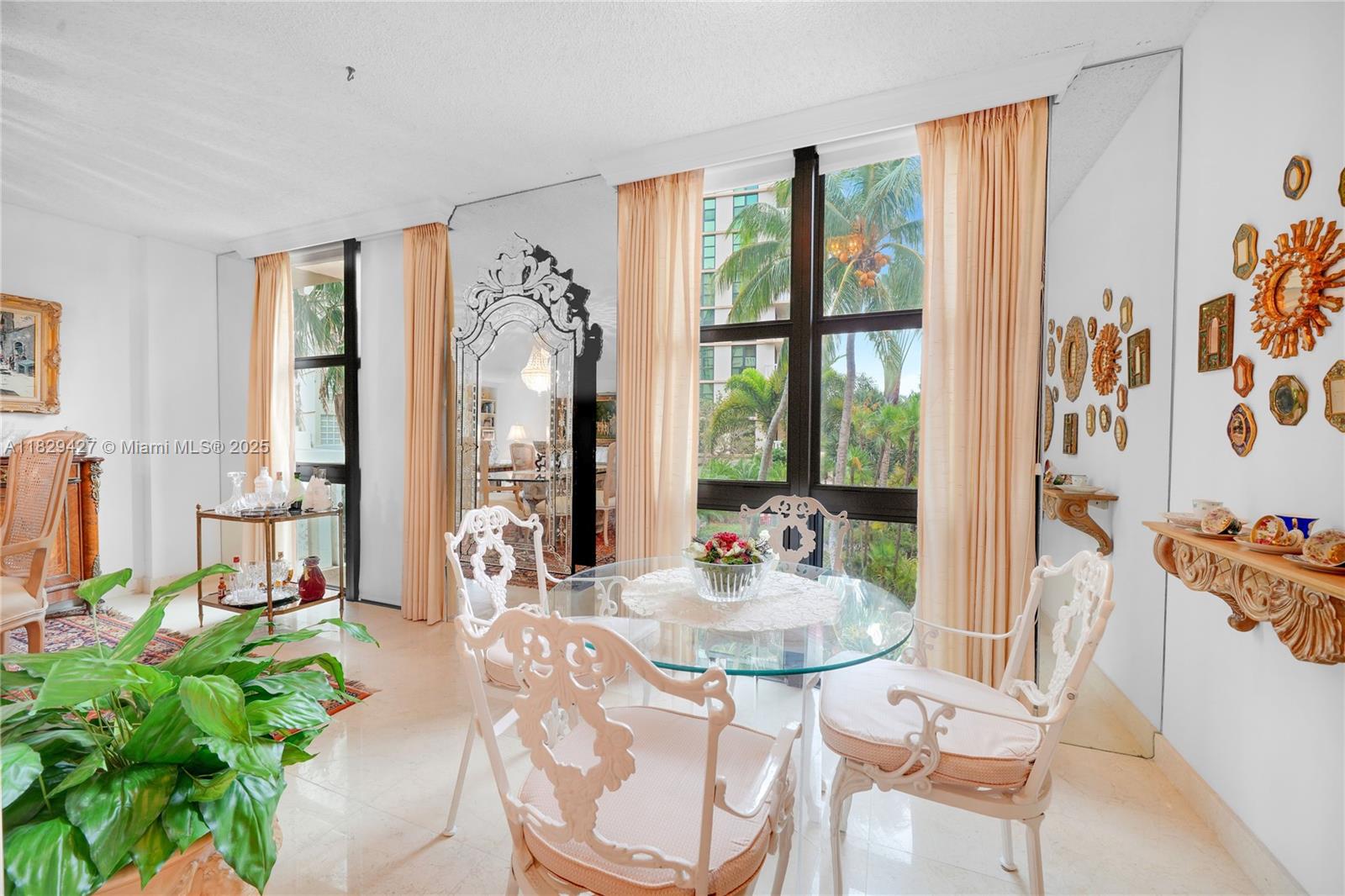 1121 Crandon Boulevard, Unit F201 Key Biscayne, FL 33149 - Photo 23 of 56 a view of a dining room with furniture window and outside view