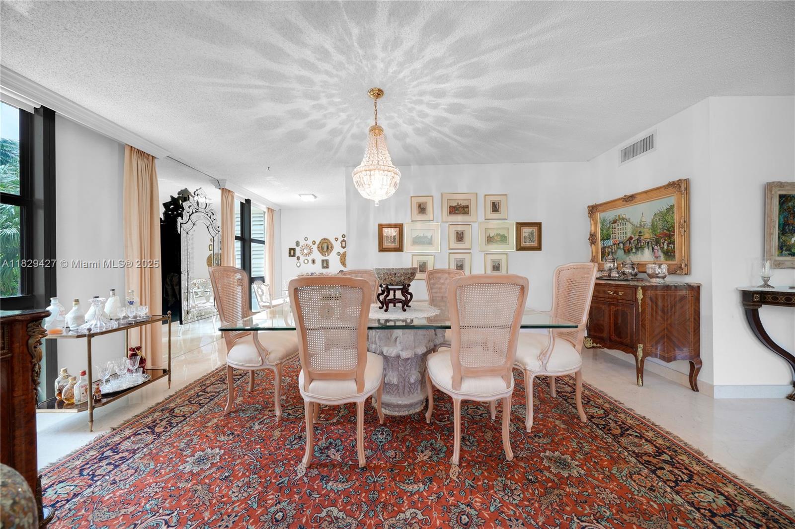 1121 Crandon Boulevard, Unit F201 Key Biscayne, FL 33149 - Photo 25 of 56 a view of a dining room with furniture