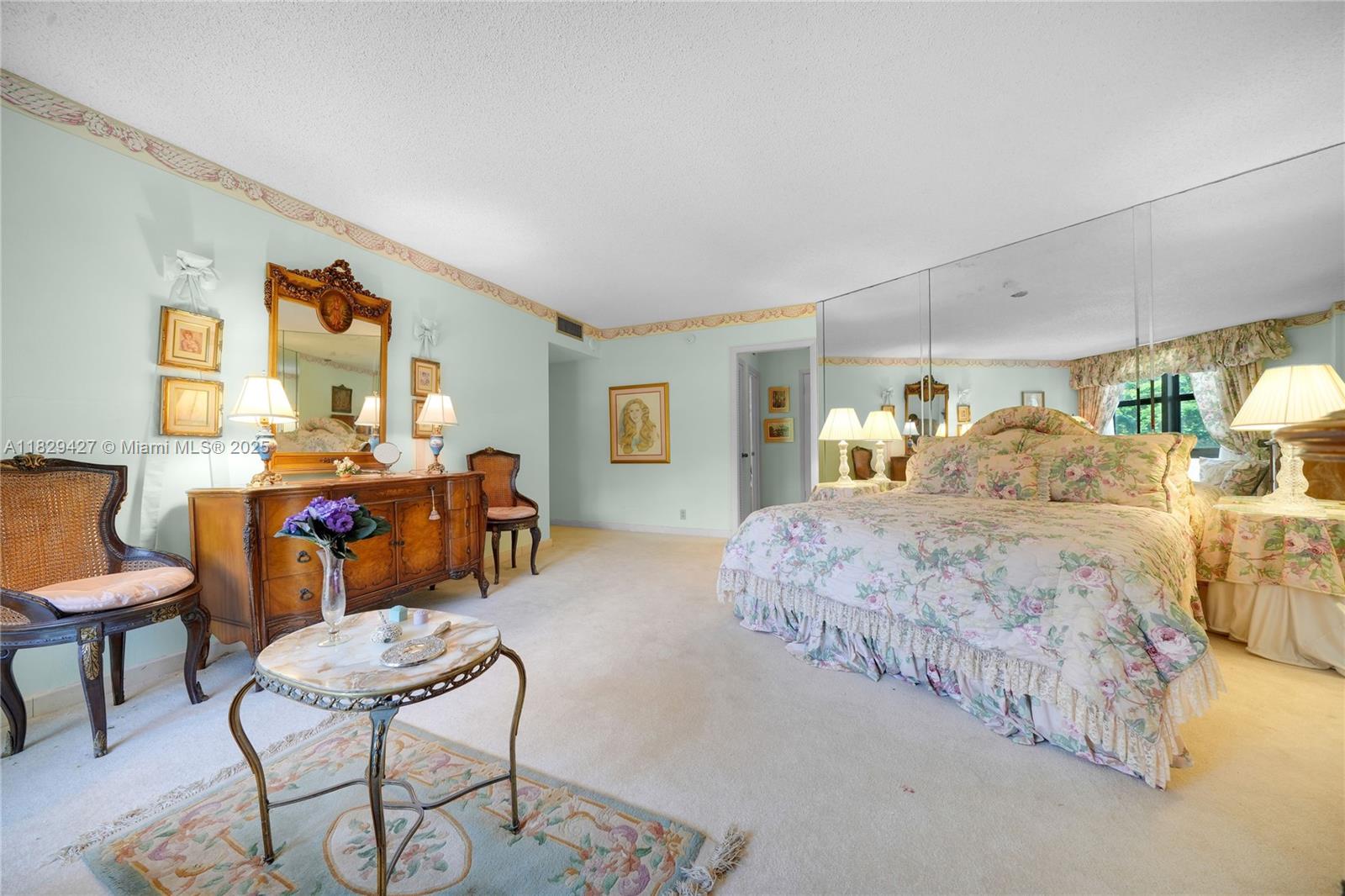 1121 Crandon Boulevard, Unit F201 Key Biscayne, FL 33149 - Photo 32 of 56 a bed room with a bed and chair