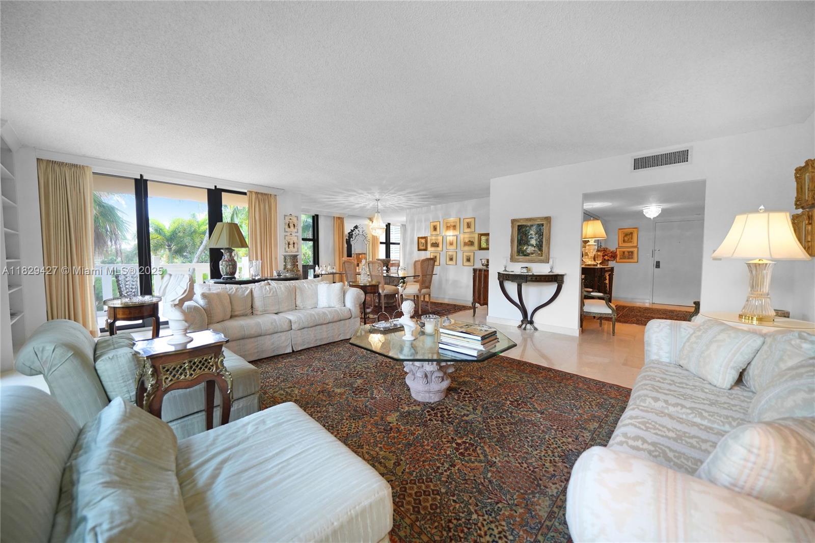 1121 Crandon Boulevard, Unit F201 Key Biscayne, FL 33149 - Photo 33 of 56 a living room with furniture and a large window