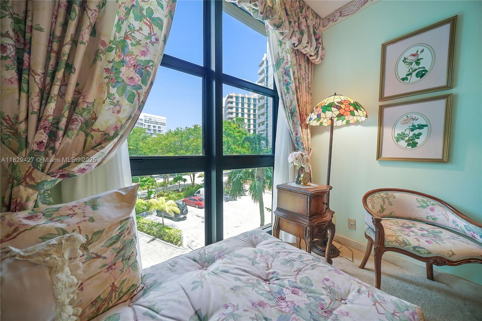 1121 Crandon Boulevard, Unit F201 Key Biscayne, FL 33149 - Photo 35 of 56 a bedroom with a bed and a chair