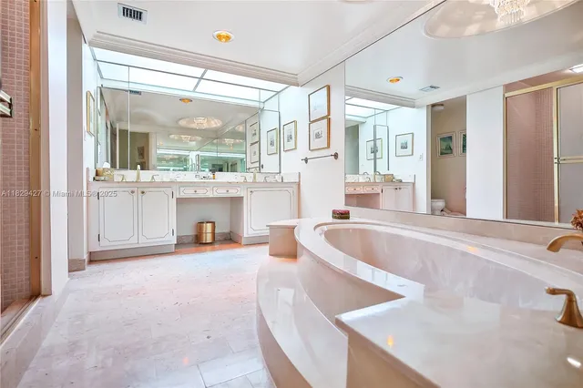 a kitchen with a refrigerator sink and cabinets