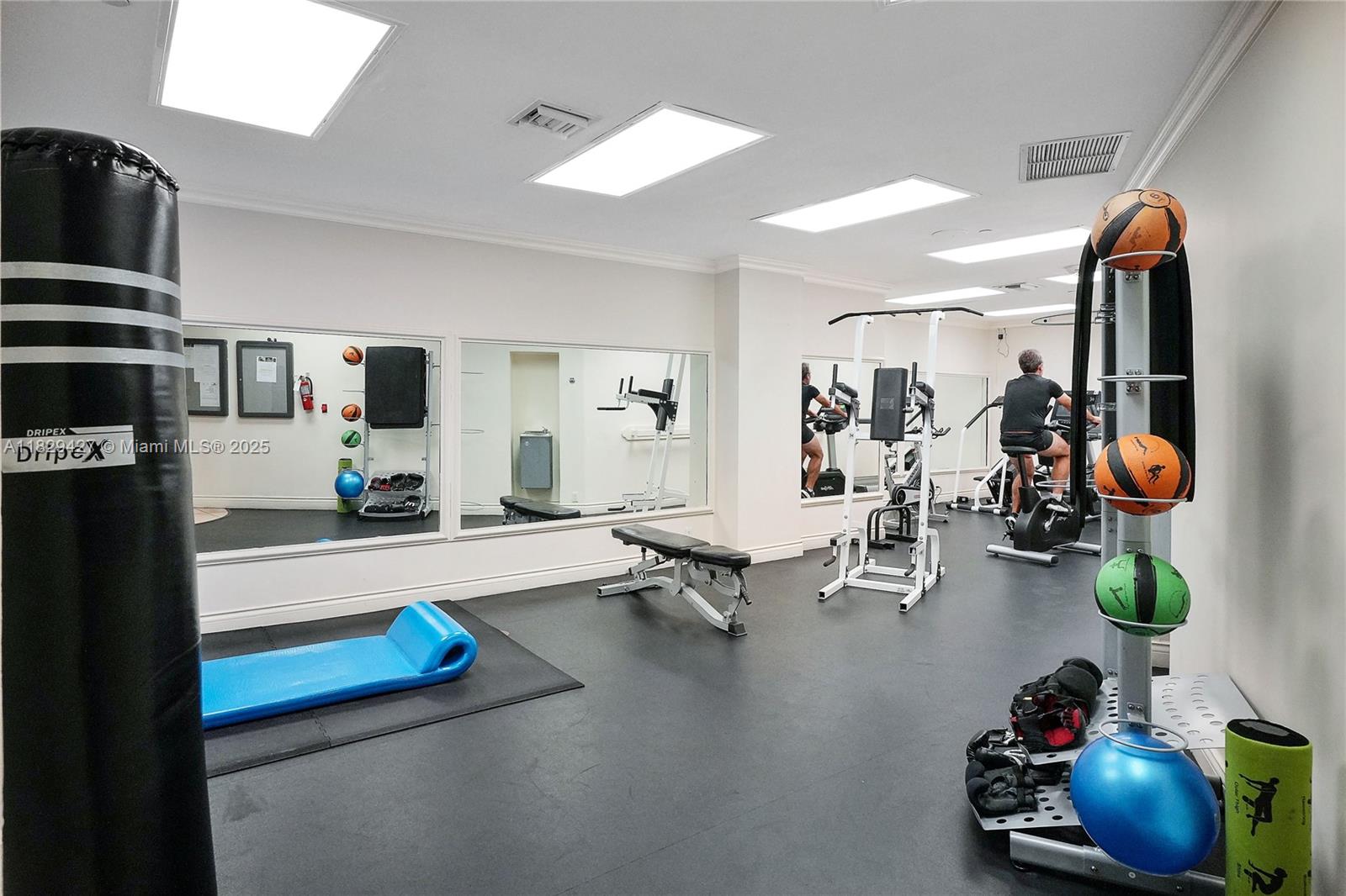 1121 Crandon Boulevard, Unit F201 Key Biscayne, FL 33149 - Photo 51 of 56 a living room with furniture and a flat screen tv