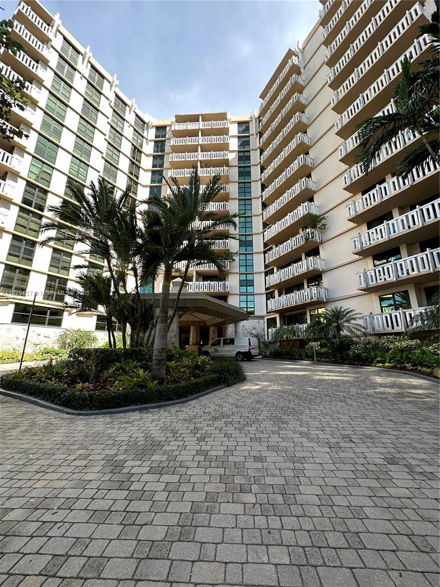 1121 Crandon Boulevard, Unit F201 Key Biscayne, FL 33149 - Photo 8 of 56 a front view of a building