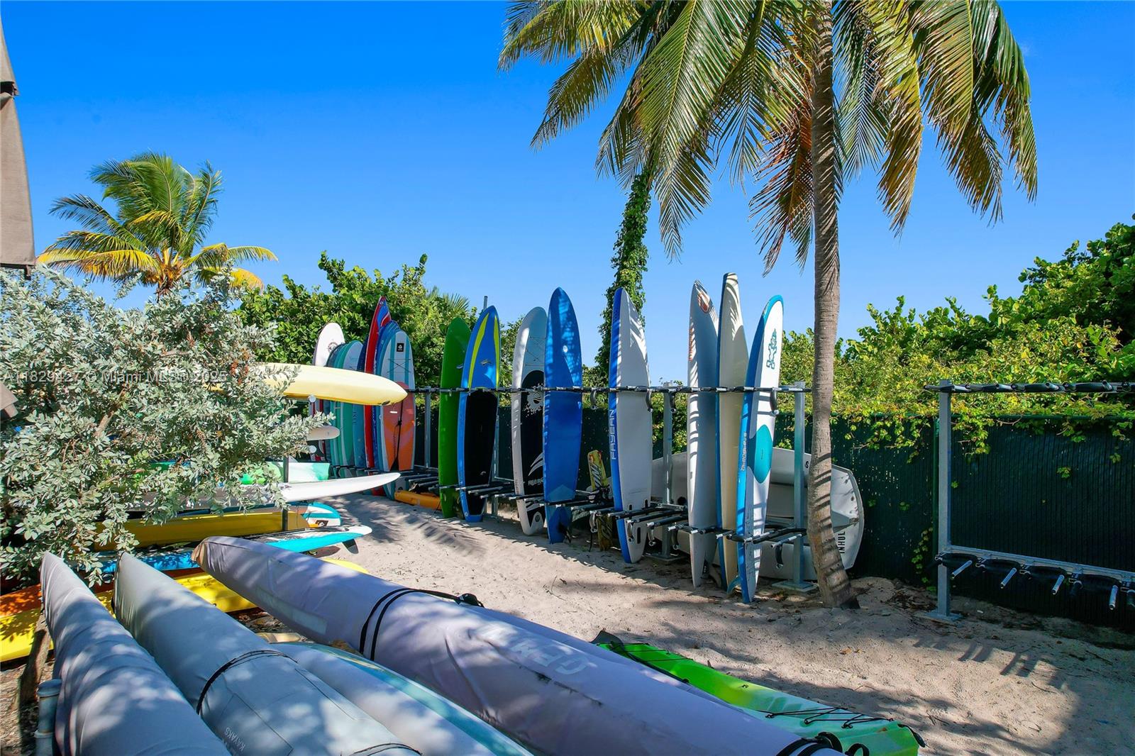 1121 Crandon Boulevard, Unit F201 Key Biscayne, FL 33149 - Photo 10 of 56 a view of a backyard with plants and a patio
