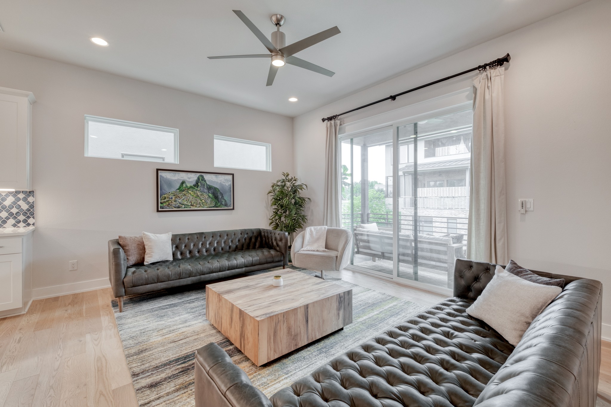 5002 Pecan Springs Road, Unit 7 Austin, TX 78723 - Photo 9 of 34 Large sliding doors provide a seamless transition from the indoor seating area to the second-floor balcony