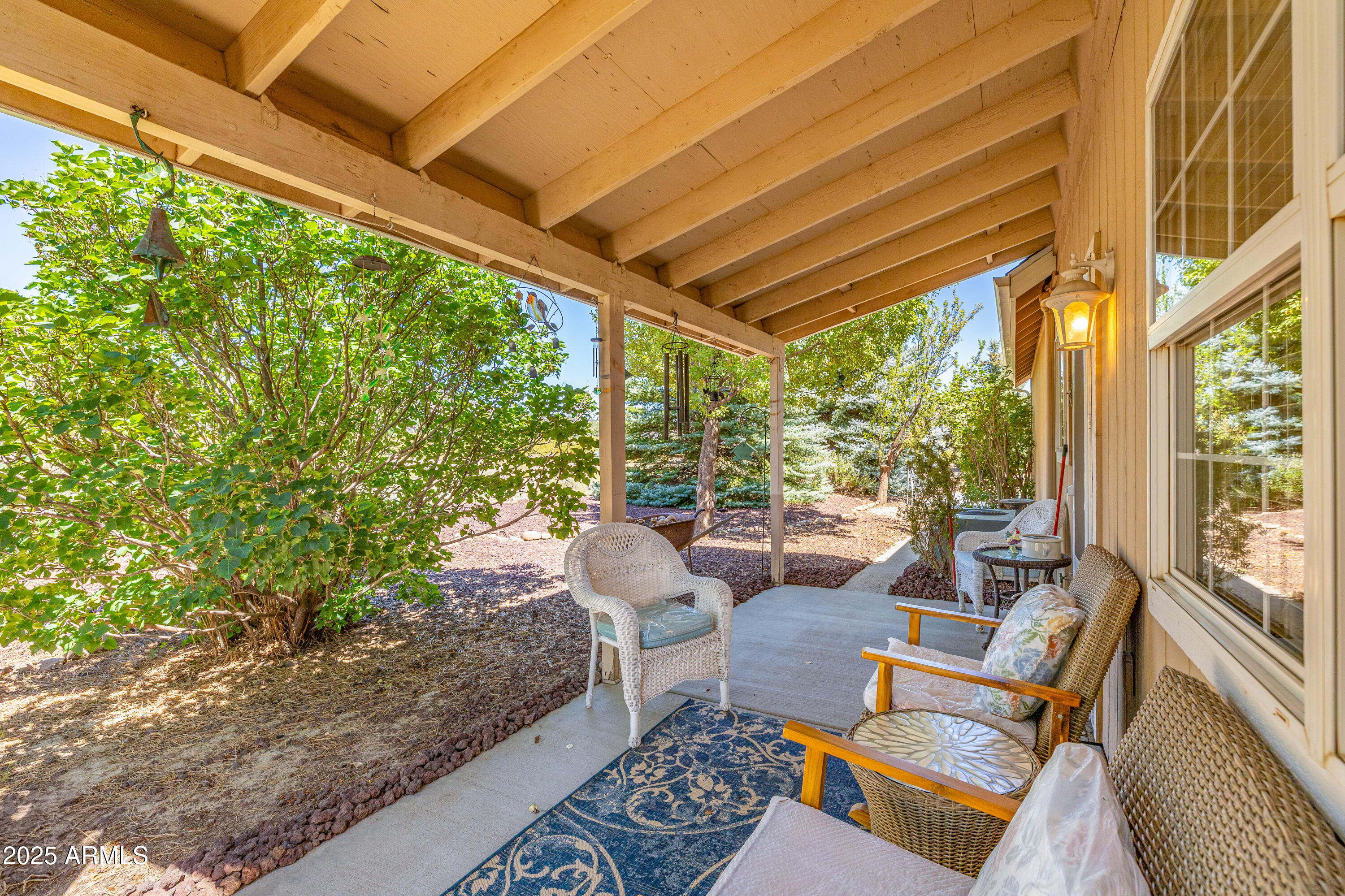 a outdoor space with patio the couches and a dining table with the view of garden