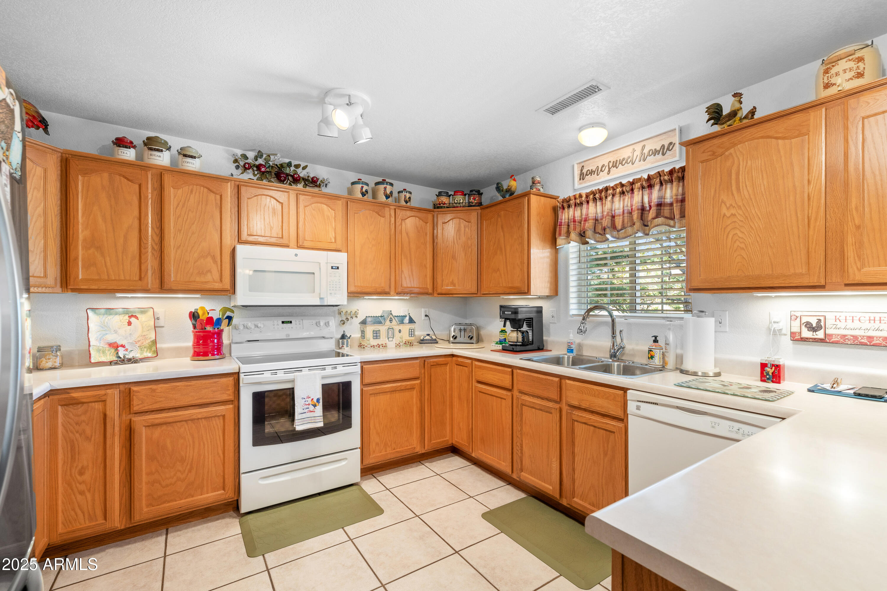 12870 Doyle Road Flagstaff, AZ 86004 - Photo 11 of 49 a kitchen with a sink a stove and cabinets