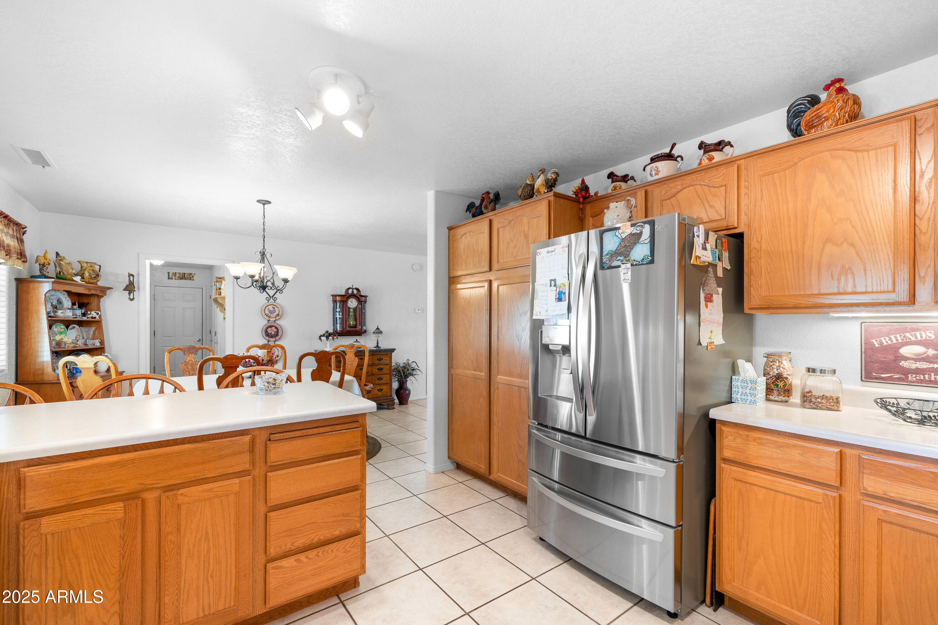 12870 Doyle Road Flagstaff, AZ 86004 - Photo 12 of 49 a kitchen with stainless steel appliances a sink and a refrigerator