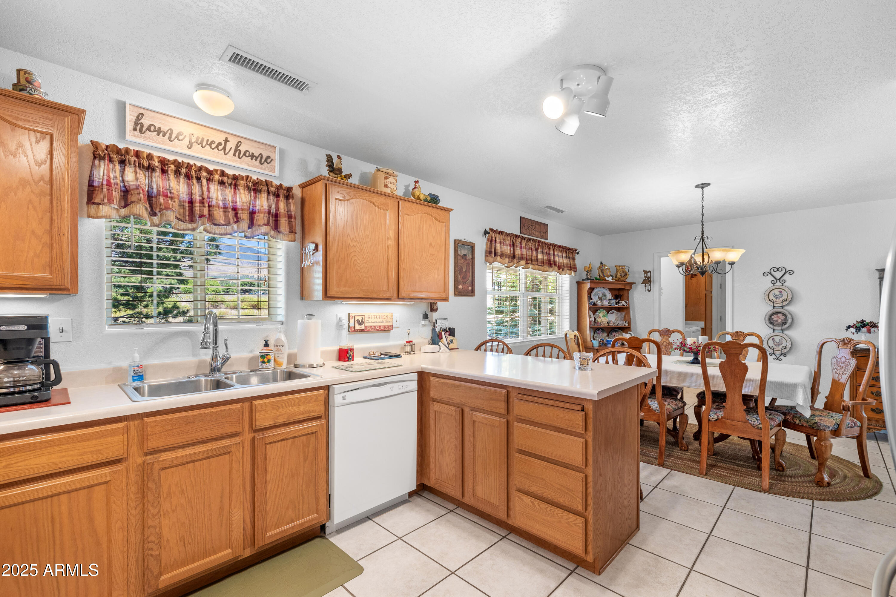 12870 Doyle Road Flagstaff, AZ 86004 - Photo 13 of 49 a kitchen with sink cabinets and window