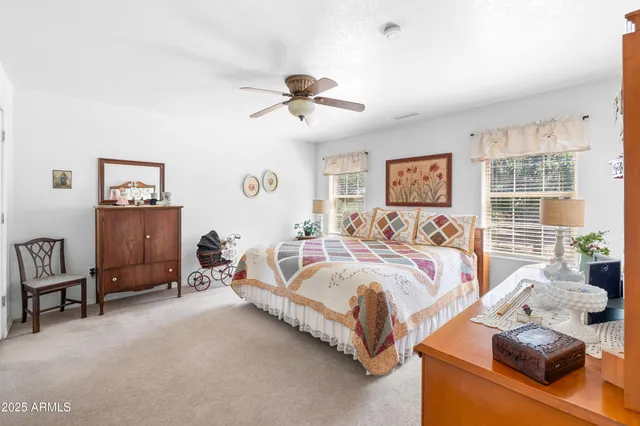 a spacious bedroom with a bed and a couch