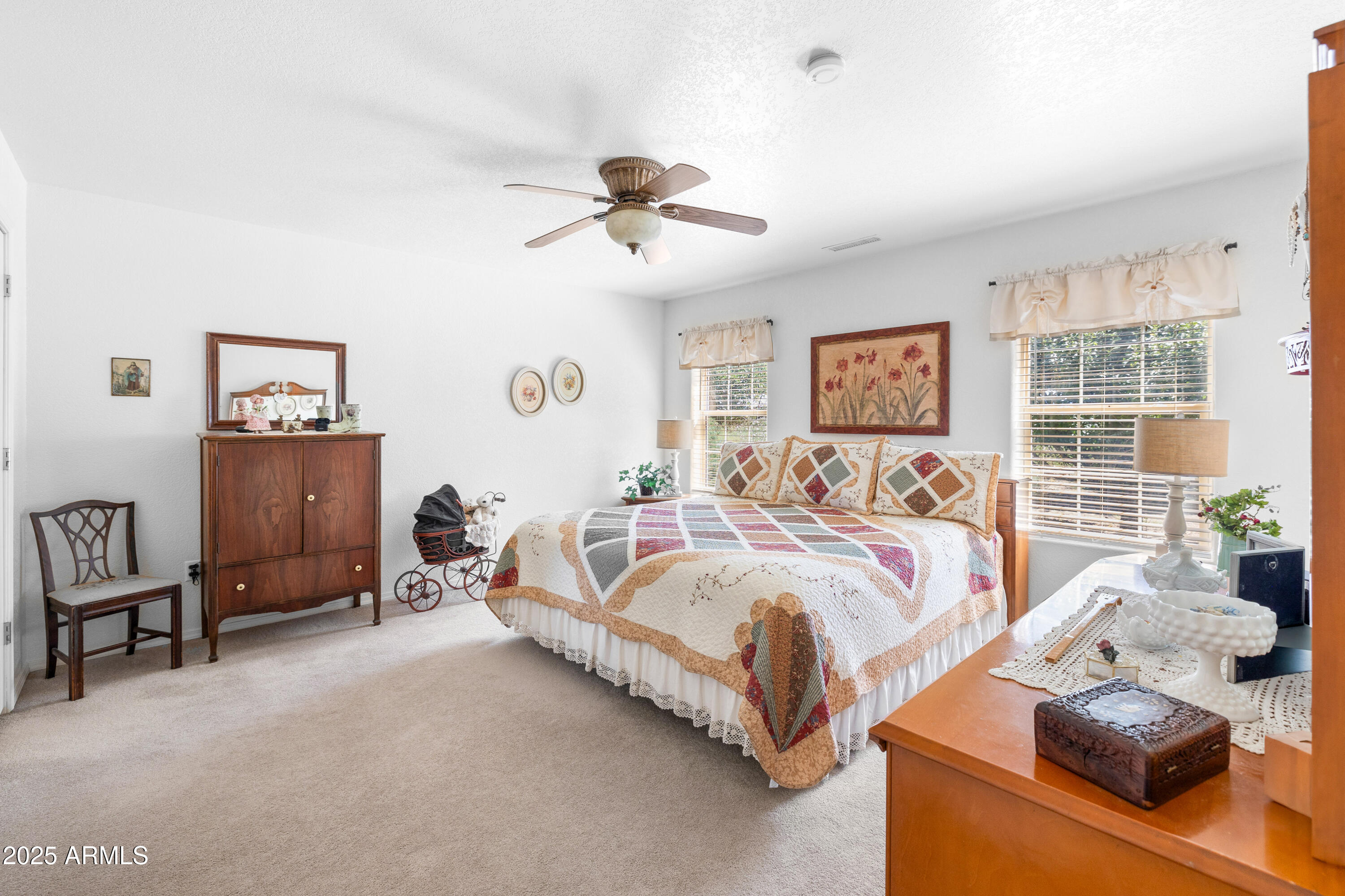 12870 Doyle Road Flagstaff, AZ 86004 - Photo 17 of 49 a spacious bedroom with a bed and a couch