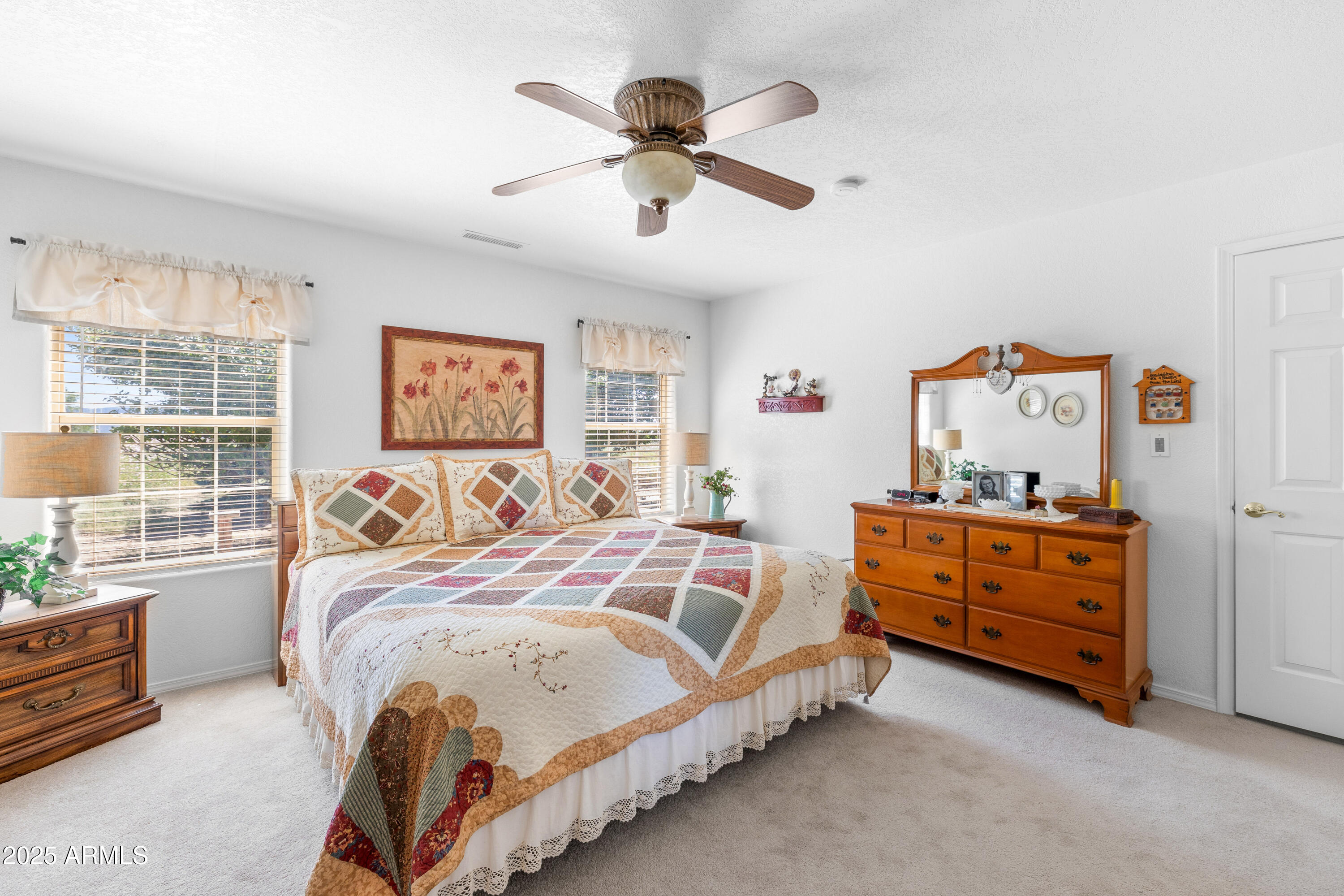 12870 Doyle Road Flagstaff, AZ 86004 - Photo 19 of 49 a bedroom with a bed and window