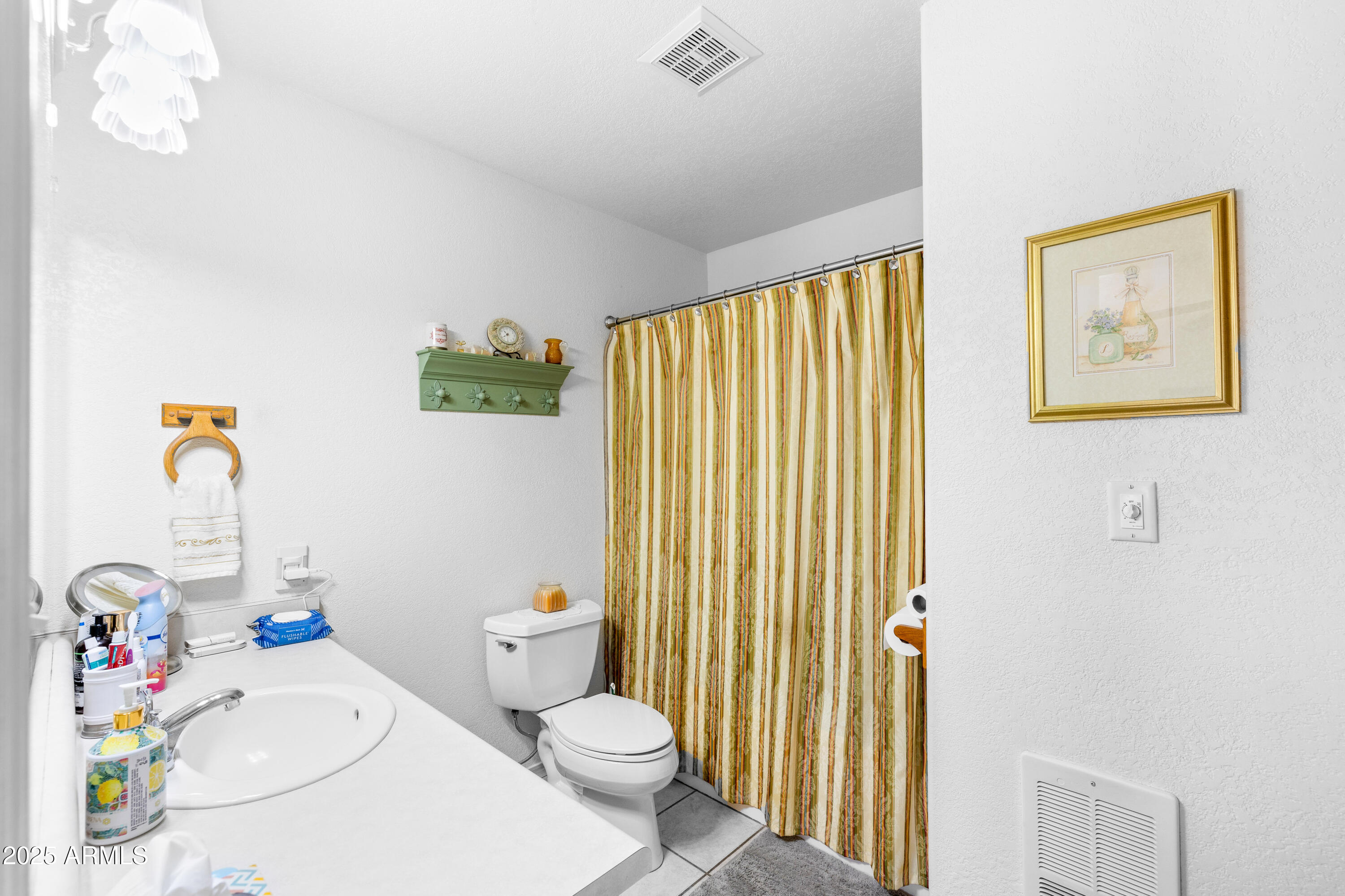 12870 Doyle Road Flagstaff, AZ 86004 - Photo 20 of 49 a white toilet sitting next to a bathroom sink