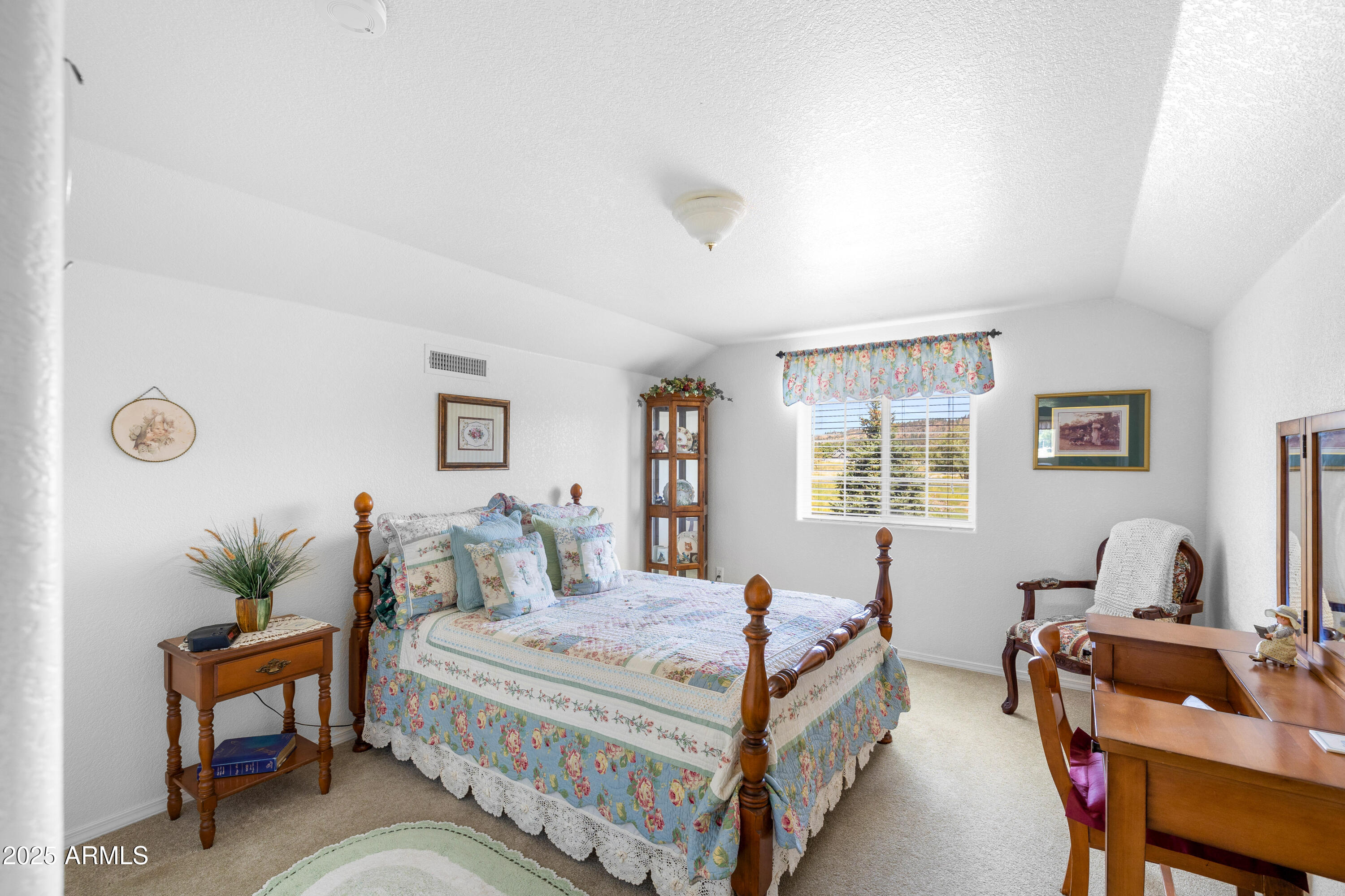 12870 Doyle Road Flagstaff, AZ 86004 - Photo 21 of 49 a bedroom with a bed and a table in it