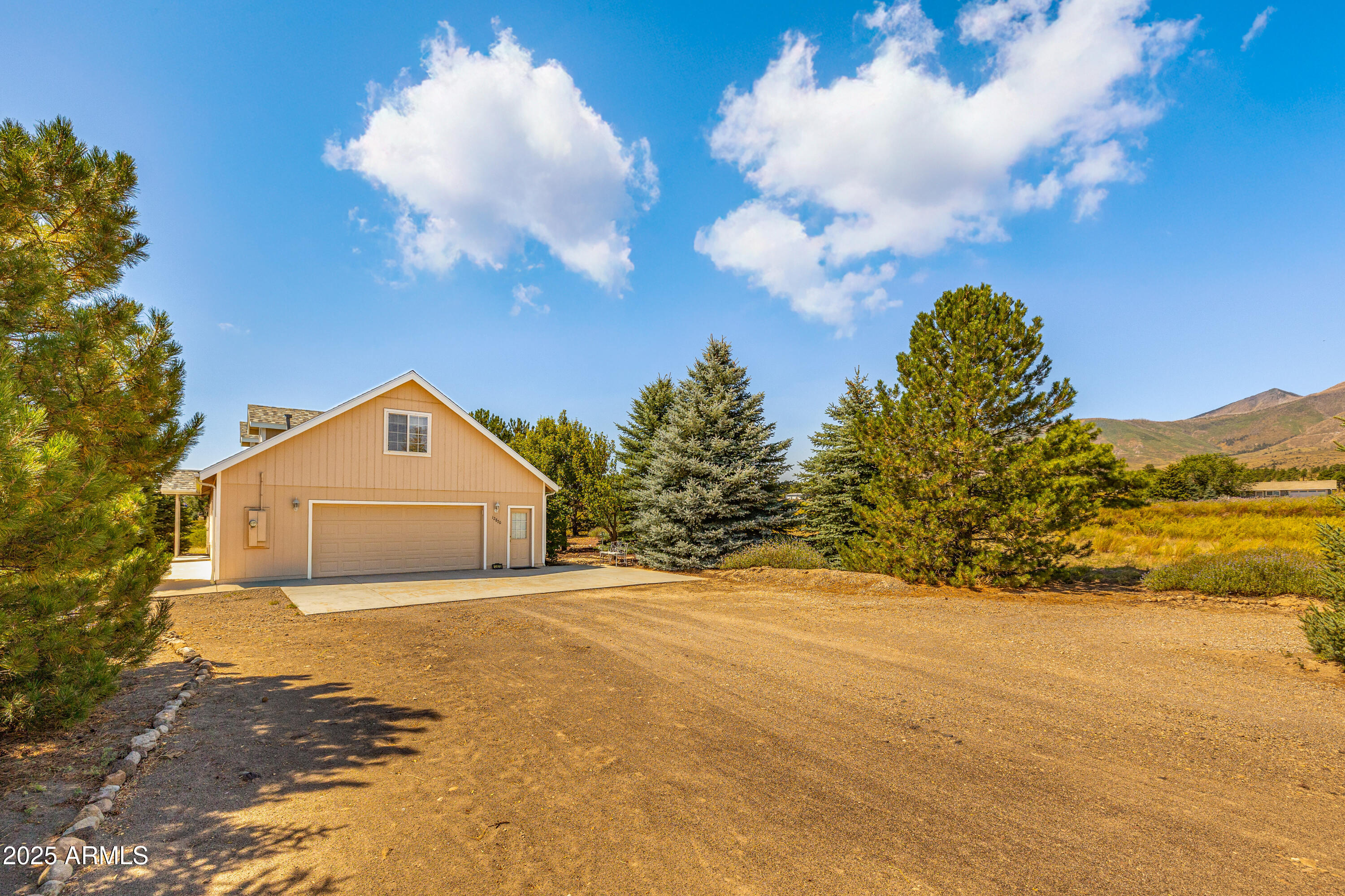12870 Doyle Road Flagstaff, AZ 86004 - Photo 29 of 49 a front view of a house with a yard