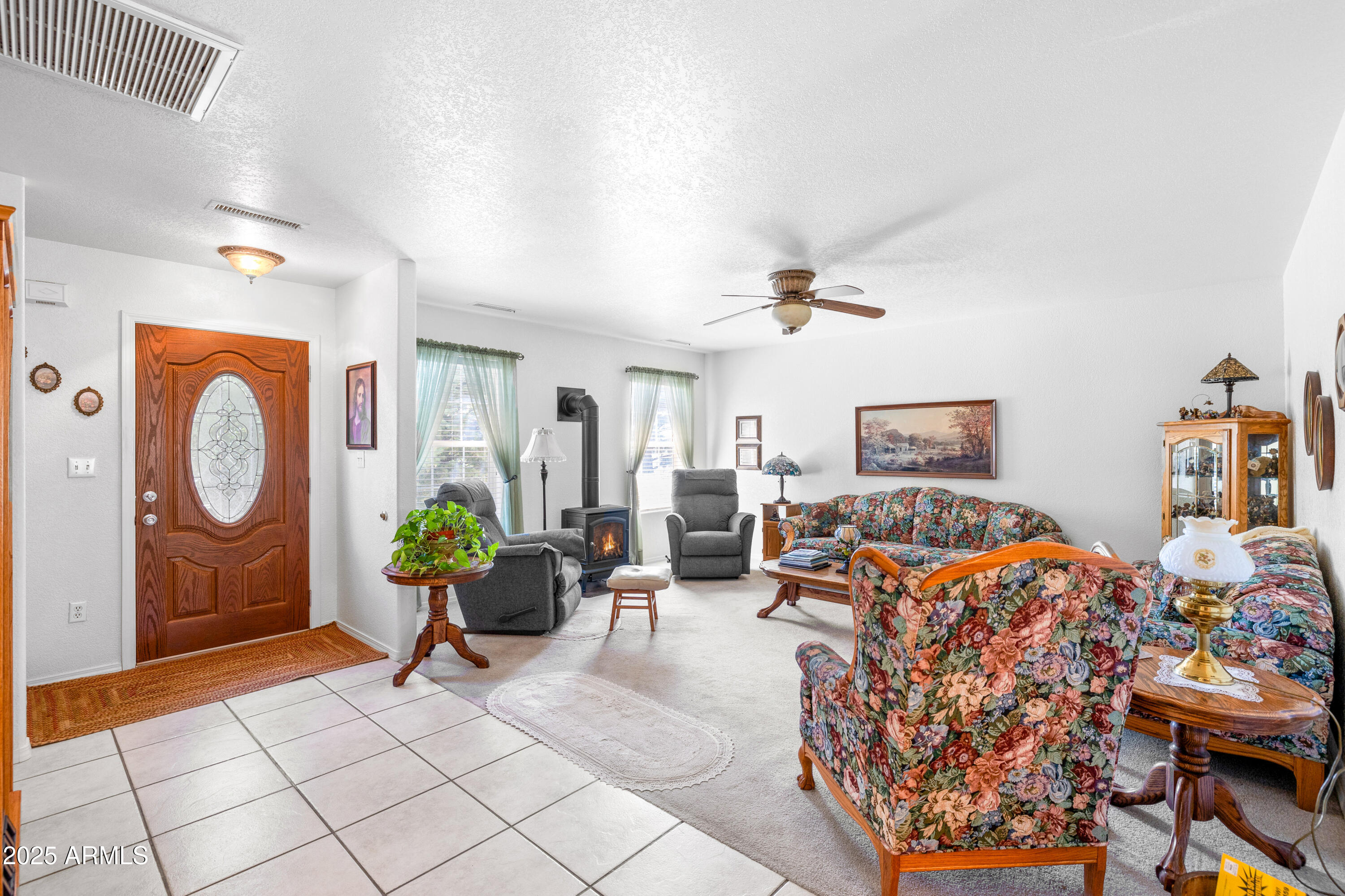 12870 Doyle Road Flagstaff, AZ 86004 - Photo 4 of 49 a living room with furniture a rug and a window