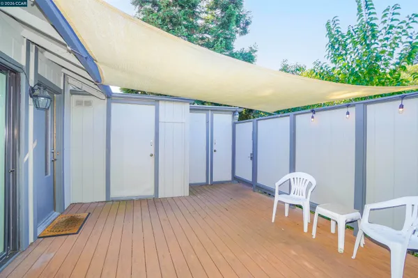 a view of a hallway with wooden floor and front door