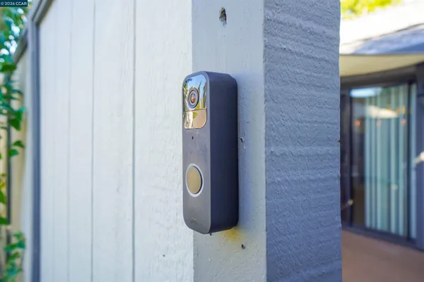 a bathroom with a granite countertop sink mirror vanity and toilet