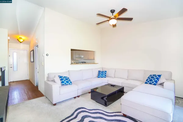 a backyard of a house with wooden floor outdoor seating and yard in back