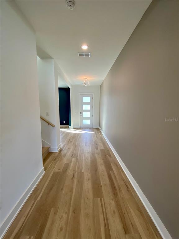 58 Overleaf Lane Orlando, FL 32839 - Photo 15 of 41 a view of a big room with wooden floor and staircase
