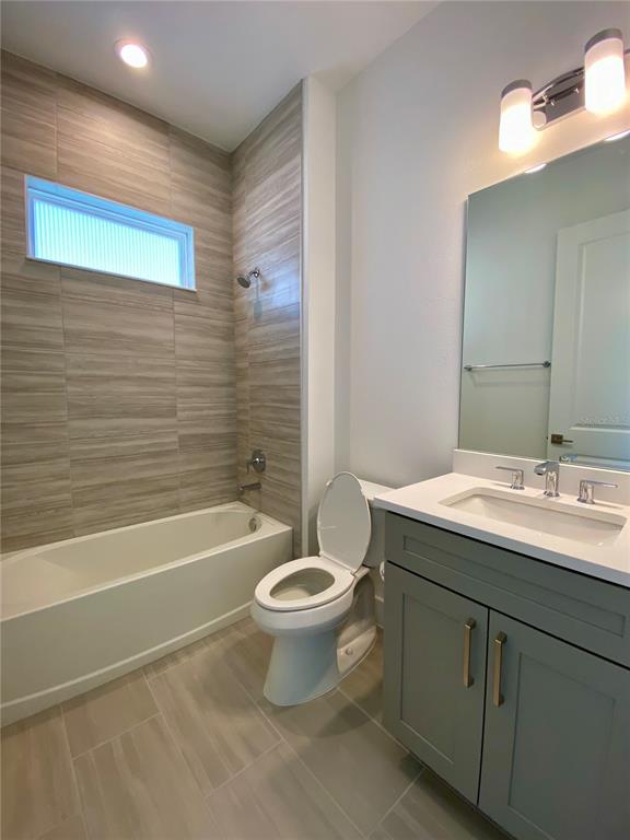58 Overleaf Lane Orlando, FL 32839 - Photo 20 of 41 a bathroom with a sink a toilet and bathtub