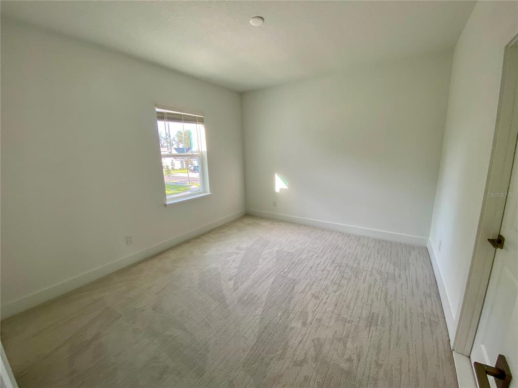 58 Overleaf Lane Orlando, FL 32839 - Photo 31 of 41 an empty room with windows